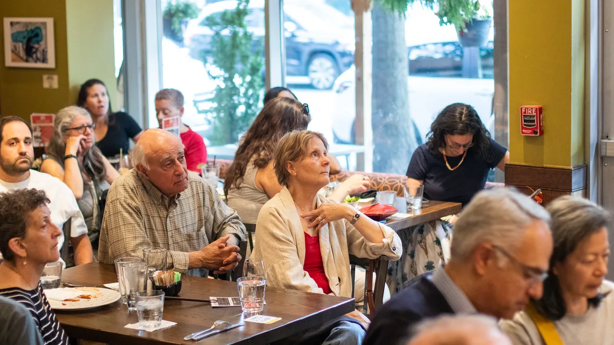 Guests gathered for a community conversation at Busboys and Poets